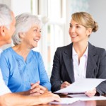 Senior Couple Discussing Finances With Advisor.